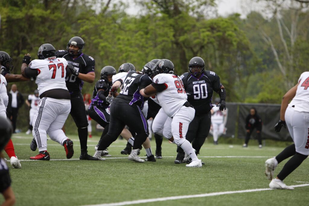 Courtney Burkett playing football