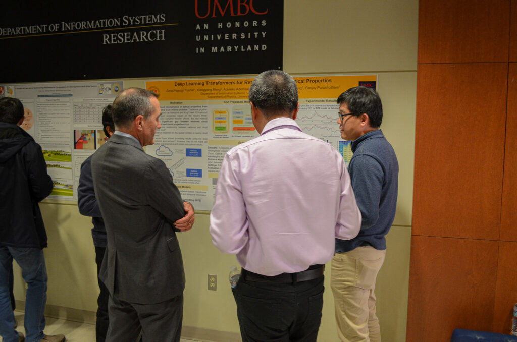participants of poster presentations discussing their research