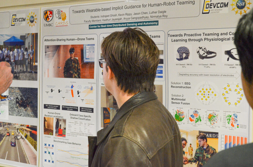 participants of poster presentations discussing their research 