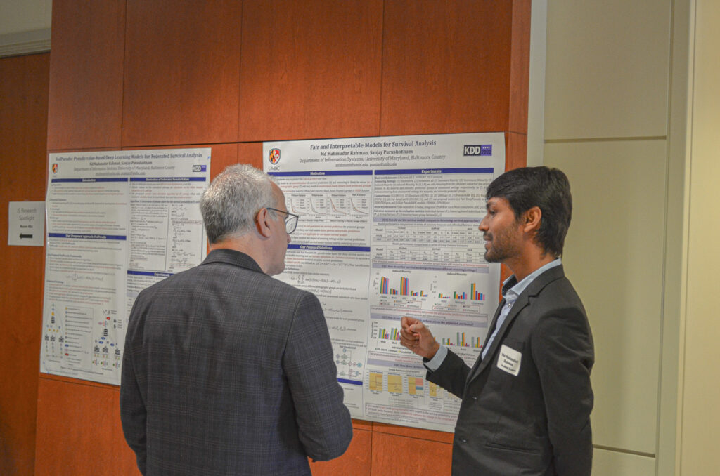 participants of poster presentations discussing their research