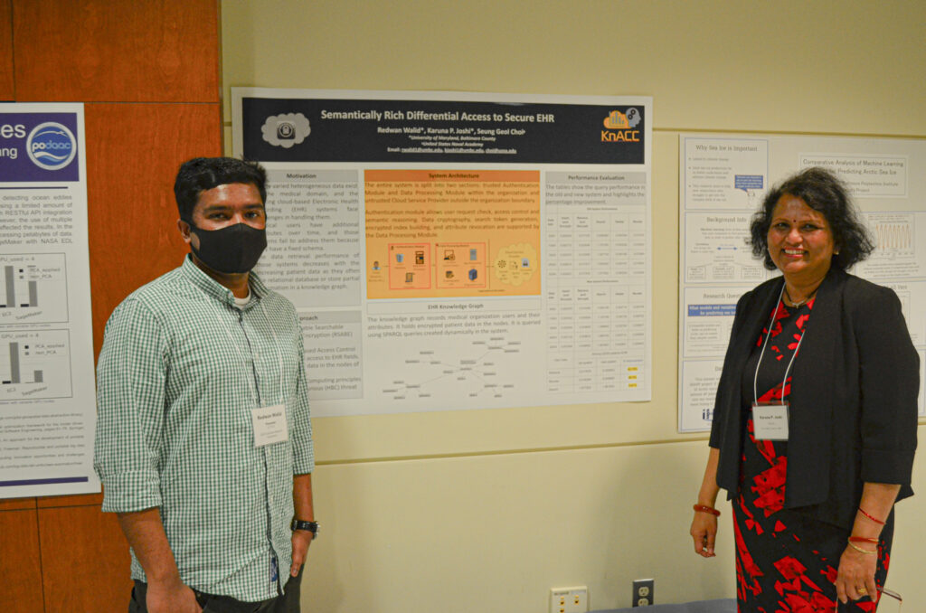 Event attendees discussing a research poster