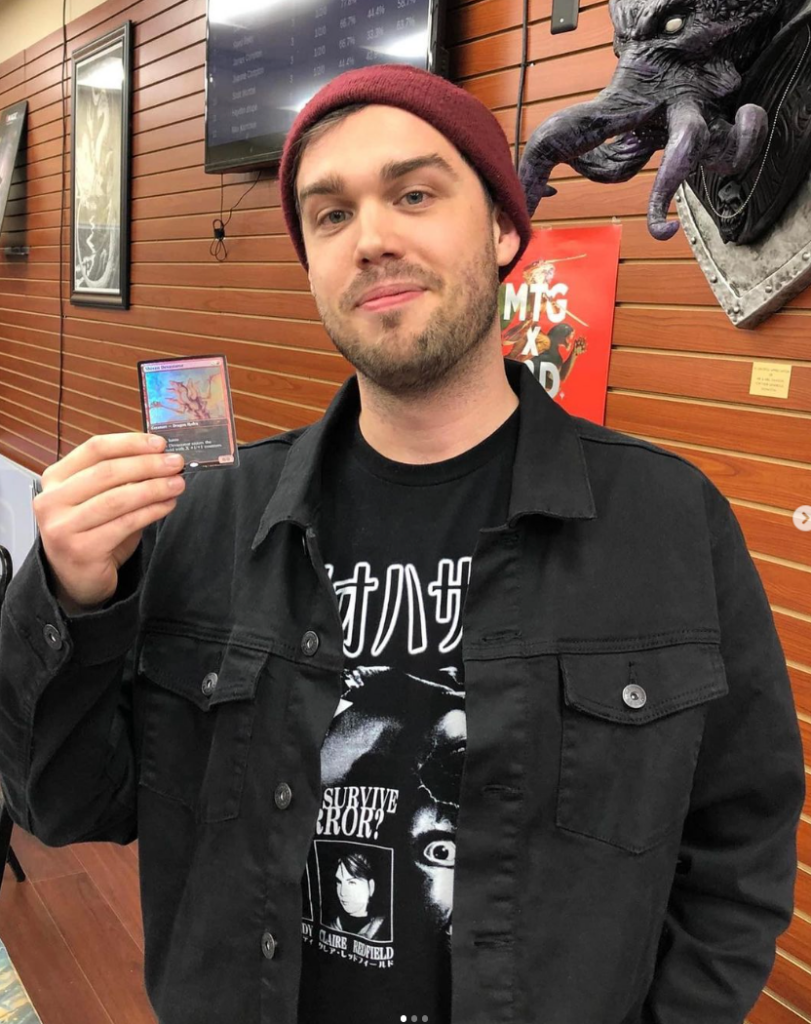 Chris Fortney holding a gaming card