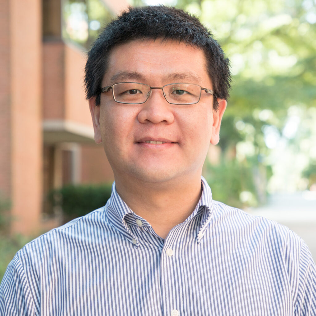 Kai Sun headshot, standing outside on campus