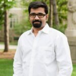 Aravind Mohan headshot, standing outside 