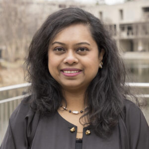 Tarannum Shaila Zaman headshot, standing in front of the UMBC library on campus