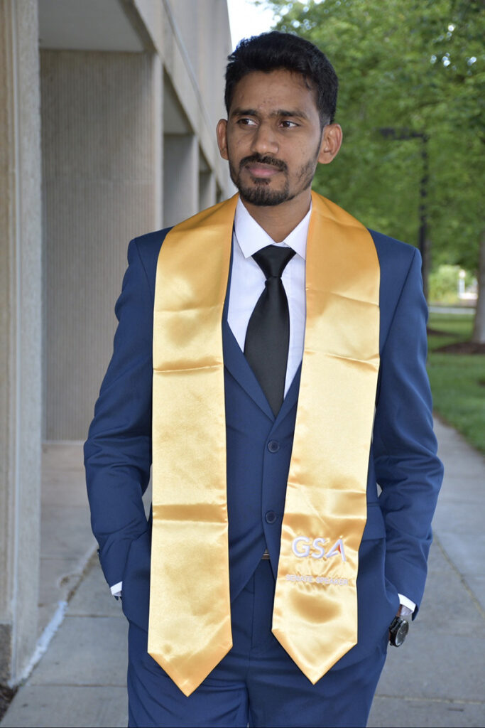 Javed Tamboli graduation photos standing outside